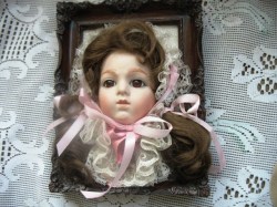9'' x 7'' MODERN BISQUE DOLL HEAD,BROWN HAIR ON PICTURE FRAME